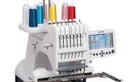 Industrial embroidery machine on a white background